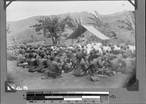 Missionary Zeeb administers baptism in front of the congregation, Isoko, Tanzania, ca. 1908-1919