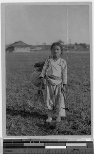 Girl standing in a field, Korea, ca. 1920-1940