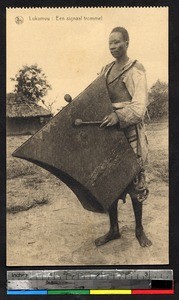 Man with signal drum, Lukumvu, Congo, ca.1920-1940