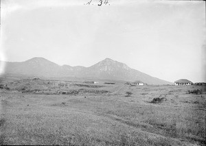 Settlement in front of mountains, Tanzania, ca.1893-1920