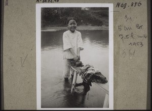 Schoolgirl washing clothes