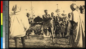 Man dancing in a circle of people, Congo, ca.1920-1940