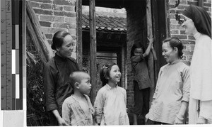 Maryknoll Sister Mary Lou Martin with women and children, Wuchow, China, ca. 1950