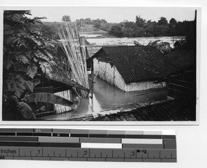 Houses collapsed by the river at Luoding, China, 1935