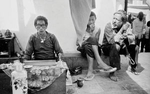 A Tibetan monk is reciting Mantras at the Boudhanath Stupa, Kathmandu, Nepal 1988