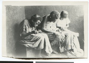 Three African women sewing, South Africa