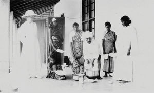 Danish Mission Hospital, Tirukoilur, Arcot, 1936. Distribution of food. The hospital cook is a