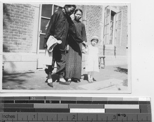 A child with her adoptive parent and aunt at Fushun, China, 1938