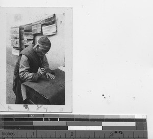 A Chinese man making signs at Pingnan, China, 1937