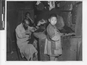 Making a suit at Wuzhou, China, 1946