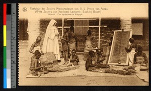 Missionary sister teaching children to weave, Rwanda, ca.1920-1940