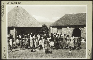 Pupils of the Girls' School in Bafut, with their dormitory and the entrance to the school