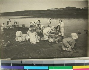 Leprous women washing their clothes in the pond, Mangarano, Madagascar