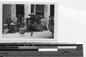 Homeward bound after shopping at the market at Yunfu, China,1936