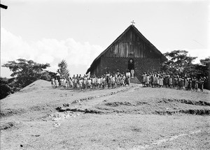 African children and adults in front of a church, Tanzania, ca.1893-1920