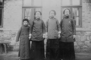 Female teachers and their smaller sister at the school in Takushan