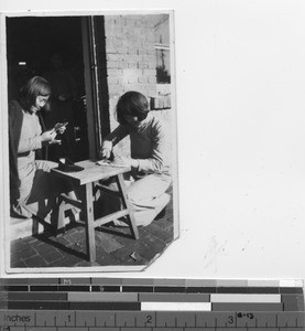 Two novices making shoes at Fushun, China, 1937