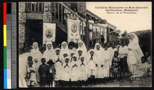 Missionary sisters outdoors with children, Madagascar, ca.1920-1940