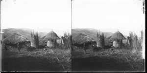 African people standing in front of huts, Lemana, South Africa