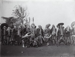 Foreign dancers with masks in Fumbam