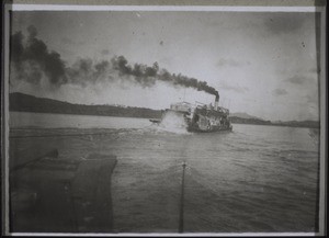 Towed up the East River by a stern-wheel steamer