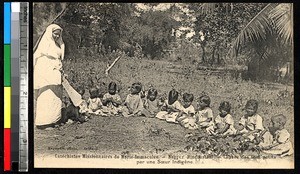 Native sister teaching toddlers, Nagpur, India, ca.1920-1940