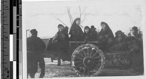 Maryknoll Sisters in a horse drawn carriage, Fushun, China, 1930