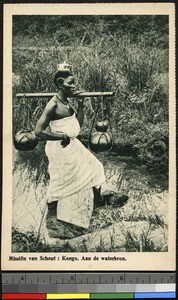 Woman transporting water, Congo, ca.1920-1940