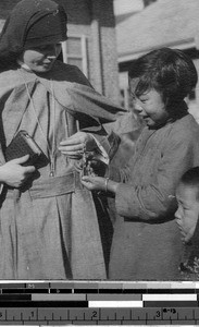 Maryknoll Sister and children, Fushun, China, ca. 1934