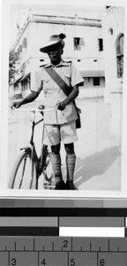 Man standing beside a bicycle, Africa, May 1947
