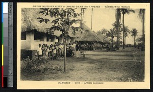 Children pose before the buildings of the regional school, Cove, Benin, ca. 1900-1930