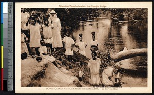 Missionary sister with girls fetching water from the stream, Niangara, Congo, ca.1900-1930
