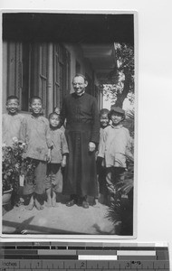 Maryknoll priest with school boys at Hong Kong, China, 1926