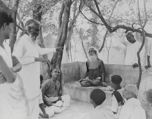 Arcot, South India. Rev. Gnanasundram, who once was a Hindu, talking to a holy man from the mou