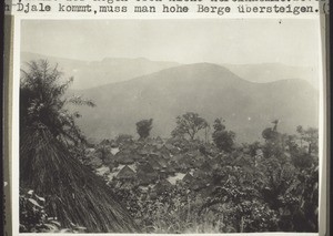 A Djale village. Inverted pots are placed on the tops of the roofs to prevent rain getting in. To get to Djale you have to cross high mountains (1928)