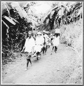 Wife of a missionary travelling on a cart, Tanzania, ca.1927-1938