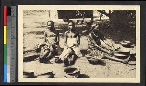 Three female potters working outdoors, Congo, ca.1920-1940