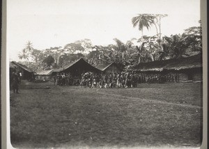 Isango dances in front of the Isangohouse in Bakumba