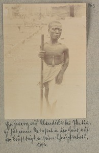 A dwarf from Chandula near Ikutha. He is holding a meter stick in the hand, at the chest he is wearing his snuffbox, Kenya