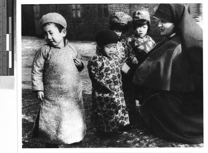 Group of orphans with a Maryknoll Sister, Loting, China, ca. 1935