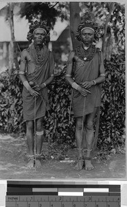 Two men wearing headdresses and multiple necklaces, Africa, ca. 1920-1940