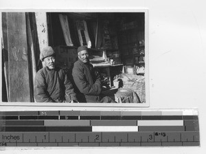 Two men downtown at Xinbin, China