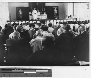 Fr. Haggerty preaching in a church at Chiatou, China, 1939