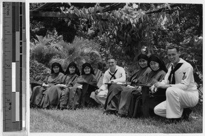 Maryknoll Sisters sitting with Navy enlisted men, Heeia, Hawaii, ca. 1940-1949