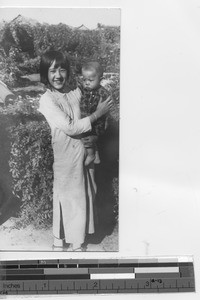 Young girl and baby at Tonghua, China, 1939