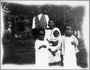 Assistant teacher Mardos and his family, Arusha, Tanzania, 1924