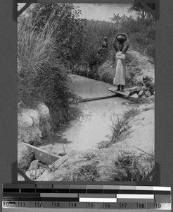 Near Urambo. A woman fetching water, Tanzania