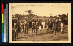 Men transporting a missionary, Togo, Africa, ca. 1920-1940