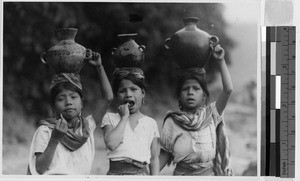 Three girls carrying water jugs on their heads, Guatemala, ca. 1946