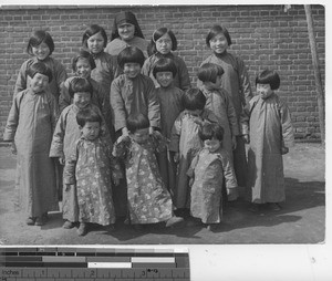 Maryknoll sister and orphans at Fushun, China, 1936
